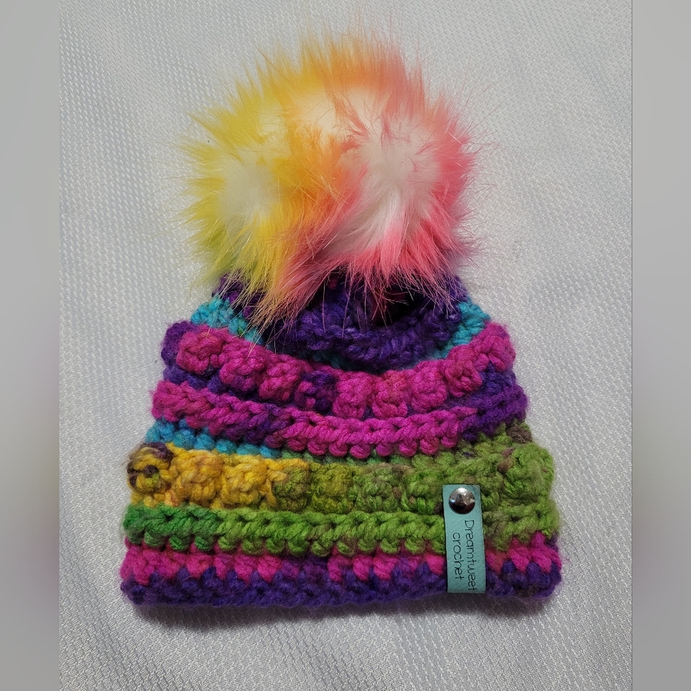 Infant to toddler crochet rainbow beanie with puff